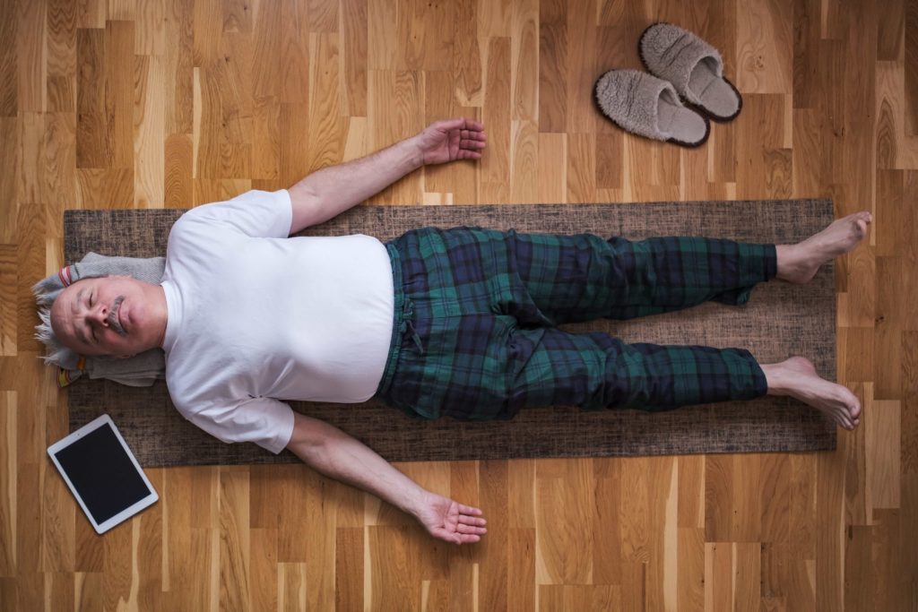 Old Man Perfroming Savasana