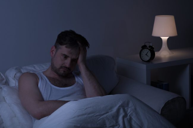 Stressed man not getting sleep at night in Salt Lake City, UT | Santosh Yoga Institute