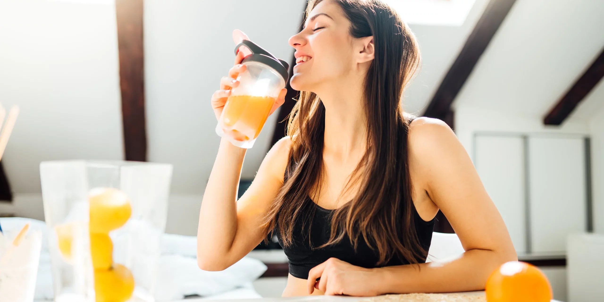 Young woman drinking healthy fruit juice in Salt Lake City, UT | Santosh Yoga Institute