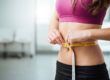 Young girl measuring her weight in Salt Lake City, UT | Santosh Yoga Institute