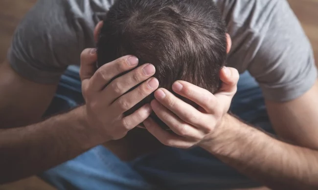Young stressed man in Salt Lake City, UT | Santosh Yoga Institute