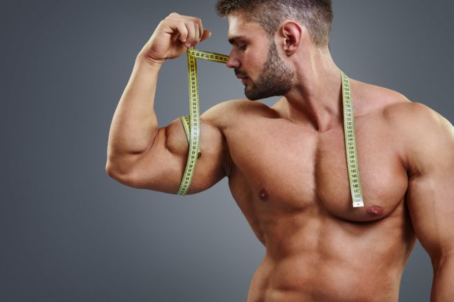 Fit healthy man measuring his Muscle Gain in Salt Lake City, UT | Santosh Yoga Institute