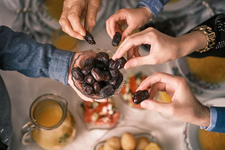 People hands sharing food in Salt Lake City, UT | Santosh Yoga Institute