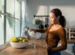 Young girl pouring a glass of water in Salt Lake City, UT | Santosh Yoga Institute