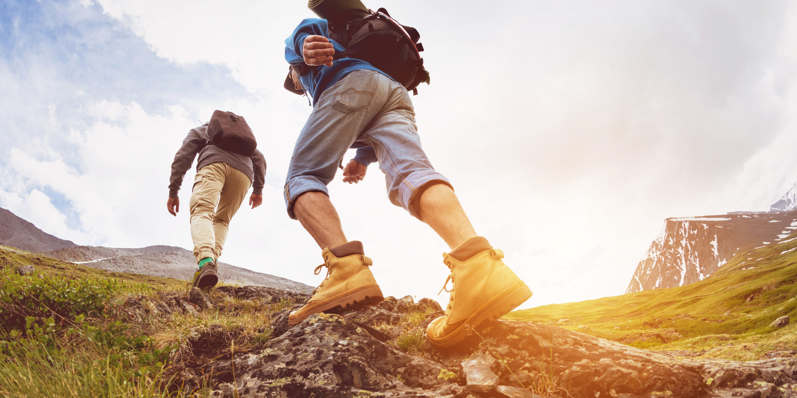 Two tourists are going up at sunset time in the mountains area in Salt Lake City, UT | Santosh Yoga Institute