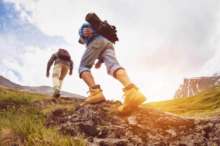 Two tourists are going up at sunset time in the mountains area in Salt Lake City, UT | Santosh Yoga Institute