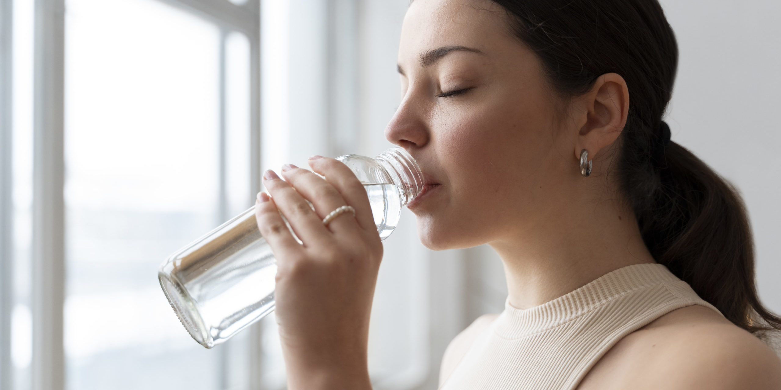 Young girl drinking water in Salt Lake City, UT | Santosh Yoga Institute