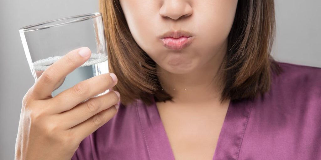Young women drinking water slowly to try to lose weight and be healthy in Salt Lake City, UT | Santosh Yoga Institute