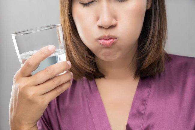 Young women drinking water slowly to try to lose weight and be healthy in Salt Lake City, UT | Santosh Yoga Institute