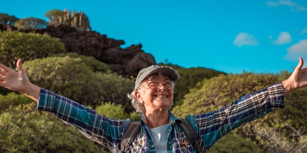 Happy old woman enjoying the fresh air in Salt Lake City, UT | Santosh Yoga Institute