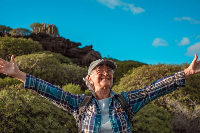 Happy old woman enjoying the fresh air in Salt Lake City, UT | Santosh Yoga Institute