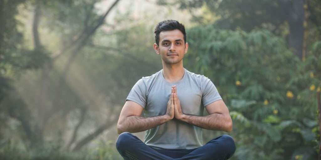 Young man doing Yoga for stress relief in Salt Lake City, UT | Santosh Yoga Institute