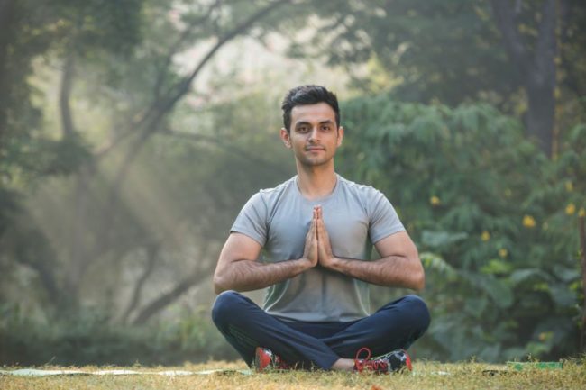 Young man doing Yoga for stress relief in Salt Lake City, UT | Santosh Yoga Institute